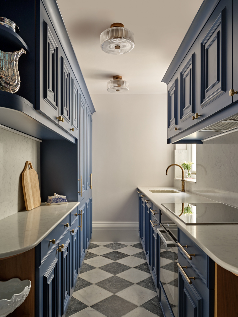 Blue kitchen by Next Chapter Design in Belgravia apartment